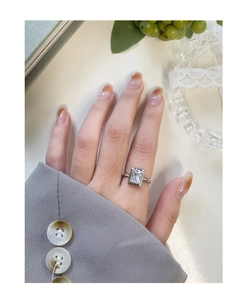 Detail of S925 silver ring featuring a large rectangular zircon on a model finger
