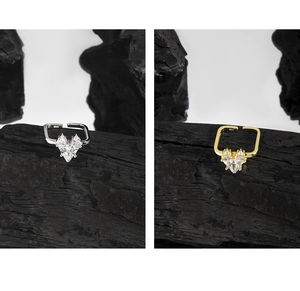 Macro detail of S925 silver square open rings with heart zircon in gold and silver finish