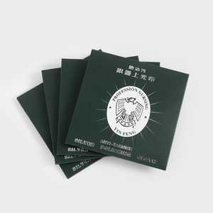 Macro view of dark green anti-tarnish silver polishing cloths for jewelry care