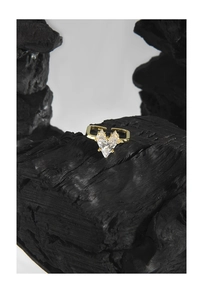 Macro shot of S925 engraving on gold heart ring set with a large sparkling zircon