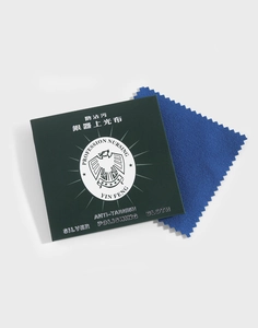 Close-up of blue silver polishing cloth with green anti-tarnish packaging card