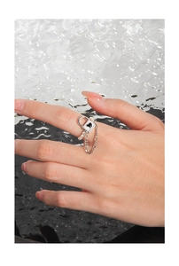 Close-up of S925 silver ring featuring heart padlock charm with pearls and chain detail