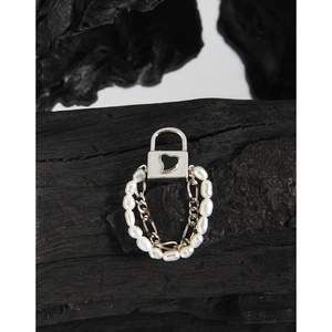 Elegant S925 silver ring featuring a black heart padlock and pearl chain detail