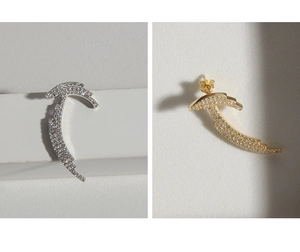 Detail of curved S925 silver earrings with micro-set zircons in gold and silver finish