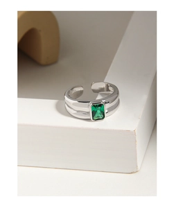 Macro detail of S925 sterling silver ring featuring a rectangular green zircon stone