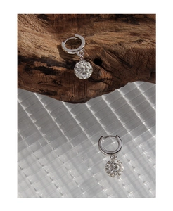 Macro detail of S925 silver disco ball earrings with sparkling pave-set cubic zirconia