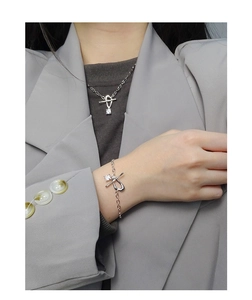 Close-up of minimalist S925 silver OT buckle necklace and bracelet set with square zircon