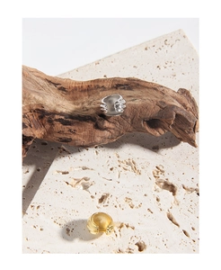 Macro view of organic wavy S925 sterling silver rings in gold and silver finishes