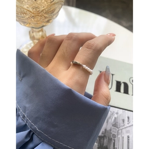 Elegant S925 sterling silver ring featuring delicate pearls and a geometric arc design