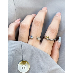 S925 sterling silver geometric rings with blue gemstone and gold bead on model hand
