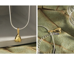 Close-up of S925 sterling silver snake chain with heart pendant and adjustable clasp
