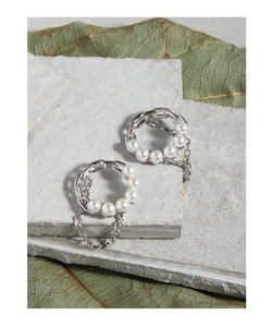 Close-up of S925 silver earrings with industrial chain link design and white pearls