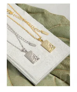 Macro shot of S925 sterling silver hammered pendant necklaces with zircon accents