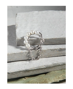 Detail of S925 silver ring featuring half pearl chain and elegant hanging chain accent