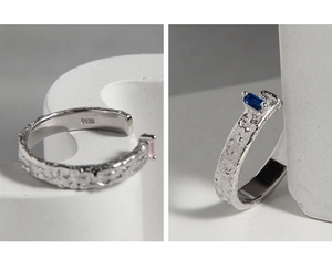 Detail of S925 sterling silver ring featuring lava texture and pink zircon inlay
