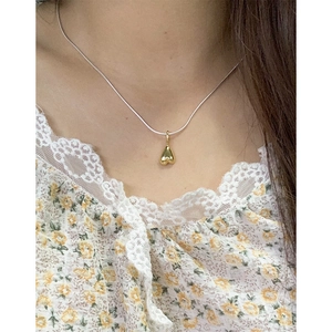 S925 sterling silver snake chain necklace with a 3D gold heart pendant on a model neck