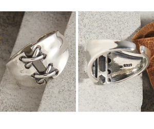 Detailed macro view of S925 sterling silver ring showing vintage laced knot texture