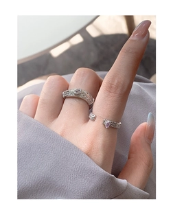 Detail view of S925 silver ring set with micro-pave zircons on a model hand