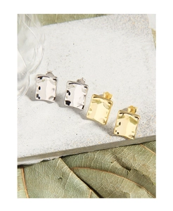 Macro shot of S925 sterling silver square earrings with hammered texture finish