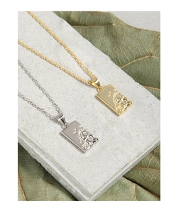 Detailed macro view of S925 silver rectangle pendants with lava texture and zircon stones