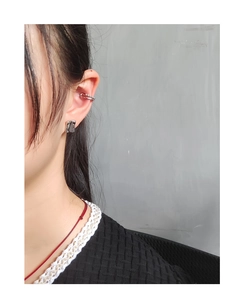 Close-up of S925 silver irregular geometric square stud and minimal double-loop ear cuff