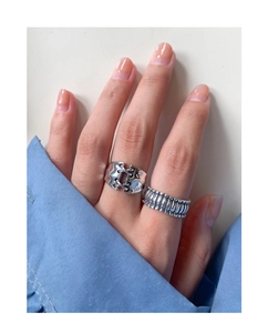 Detailed view of S925 sterling silver retro punk lace-up ring set on a female model