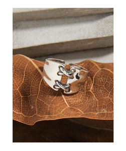 Detailed macro view of S925 sterling silver ring with unique vintage lace-up design