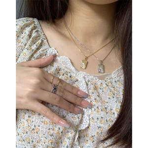 Minimalist S925 sterling silver necklaces with textured geometric pendants and rings