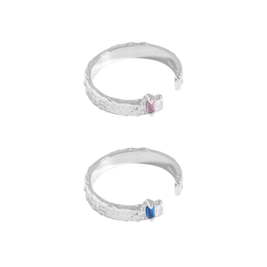 Adjustable silver rings with hammered texture and blue-pink cubic zirconia accents
