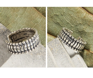 Macro view of vintage S925 sterling silver lattice ring with distressed finish and hallmarks