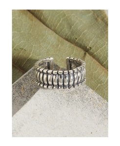 Macro view of vintage S925 sterling silver open ring with vertical textured stripe design