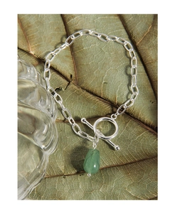 Detail of silver S925 OT bracelet featuring a green aventurine teardrop pendant on a leaf