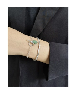 Detail of S925 silver OT clasp bracelet with green aventurine and twisted bangle