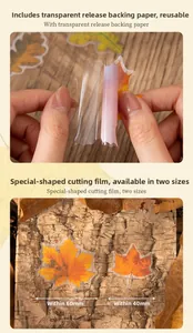 Detail of fall leaf stickers showing translucent PET material and application on wood