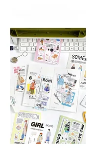 Detail view of Romantic Daily stickers with figures and quotes on a creative desk layout