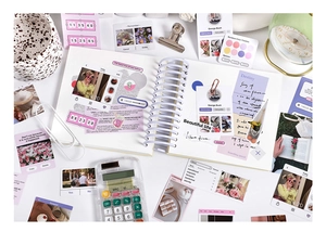 Macro view of spiral notebook with aesthetic INS style stickers and DIY decor