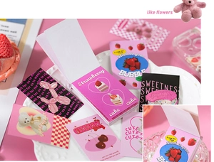Close-up of pink themed aesthetic stickers featuring cute bears and strawberry dessert patterns