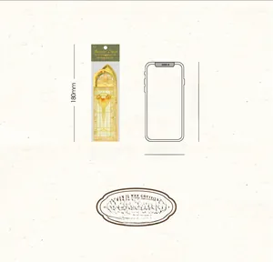 Baroque church style metal bookmark shown next to iPhone X for size comparison