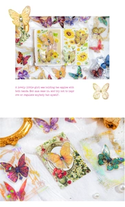 Detail of vintage butterfly stickers with gold foil and holographic finish for DIY journals