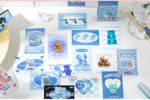 Detail showing blue themed stickers with teddy bears and vintage radio for journaling