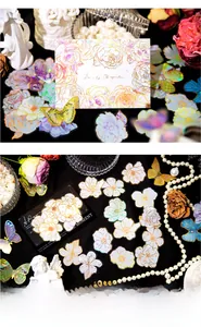 Detail of PET laser stickers with vintage floral and butterfly designs and gold edges