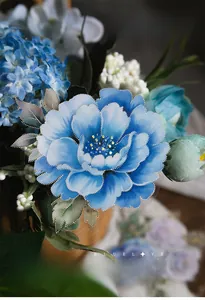 Detailed view of blue peony floral sticker with elegant gold foil accents for scrapbooking