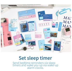 Detailed flat lay of UI-themed stickers with music and clock icons for scrapbooking