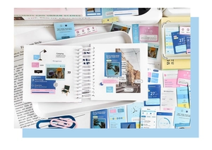 Close-up of DIY journaling set with UI style decorative stickers on a white tray