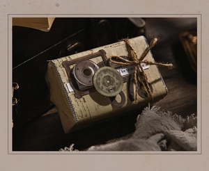 Detail of vintage junk journal material featuring twine and antique clock accessories