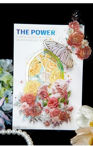 Detail of vintage PET stickers with gold foil rose, angel and butterfly motifs