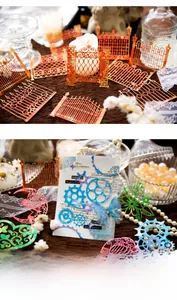Macro detail of laser-cut hollow scrapbooking cards with vintage gold foil and metal textures