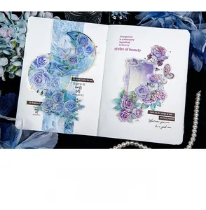 Detail of rose and butterfly PET stickers with gold foil laser edges on a journal