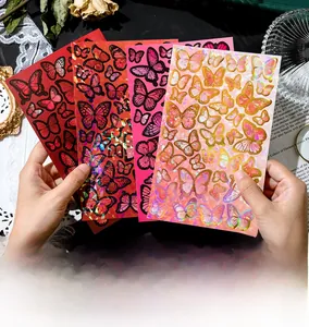 Detail of butterfly stickers with gold foil and crystal gloss on vintage books