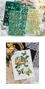 Detailed view of laser gold butterfly stickers on a vintage card for journaling scrapbooks